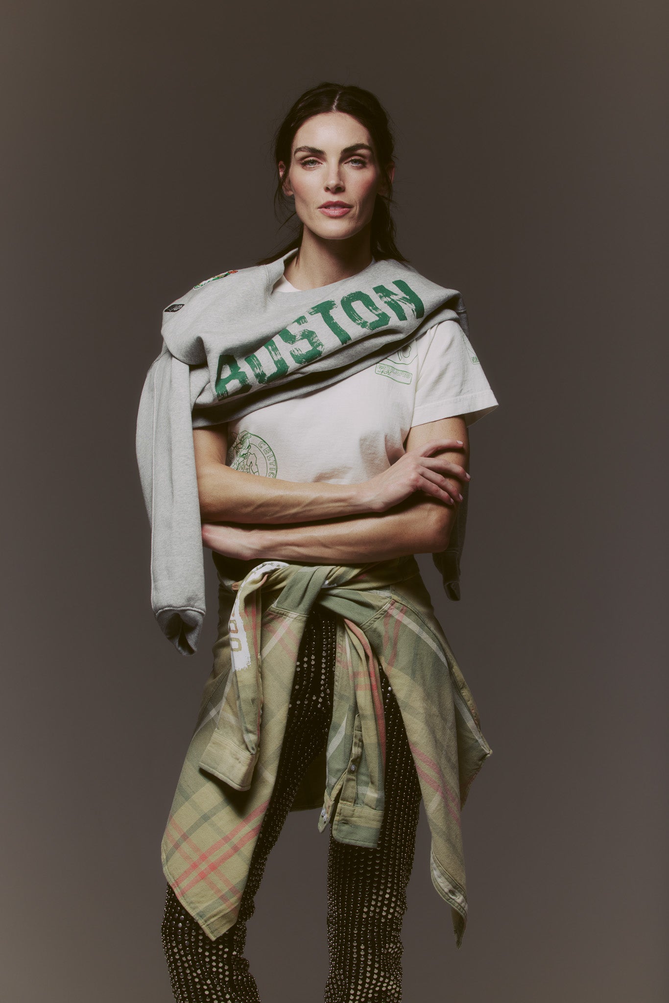 Woman wearing Sports Flannel - Celtics tied around waist with casual outfit