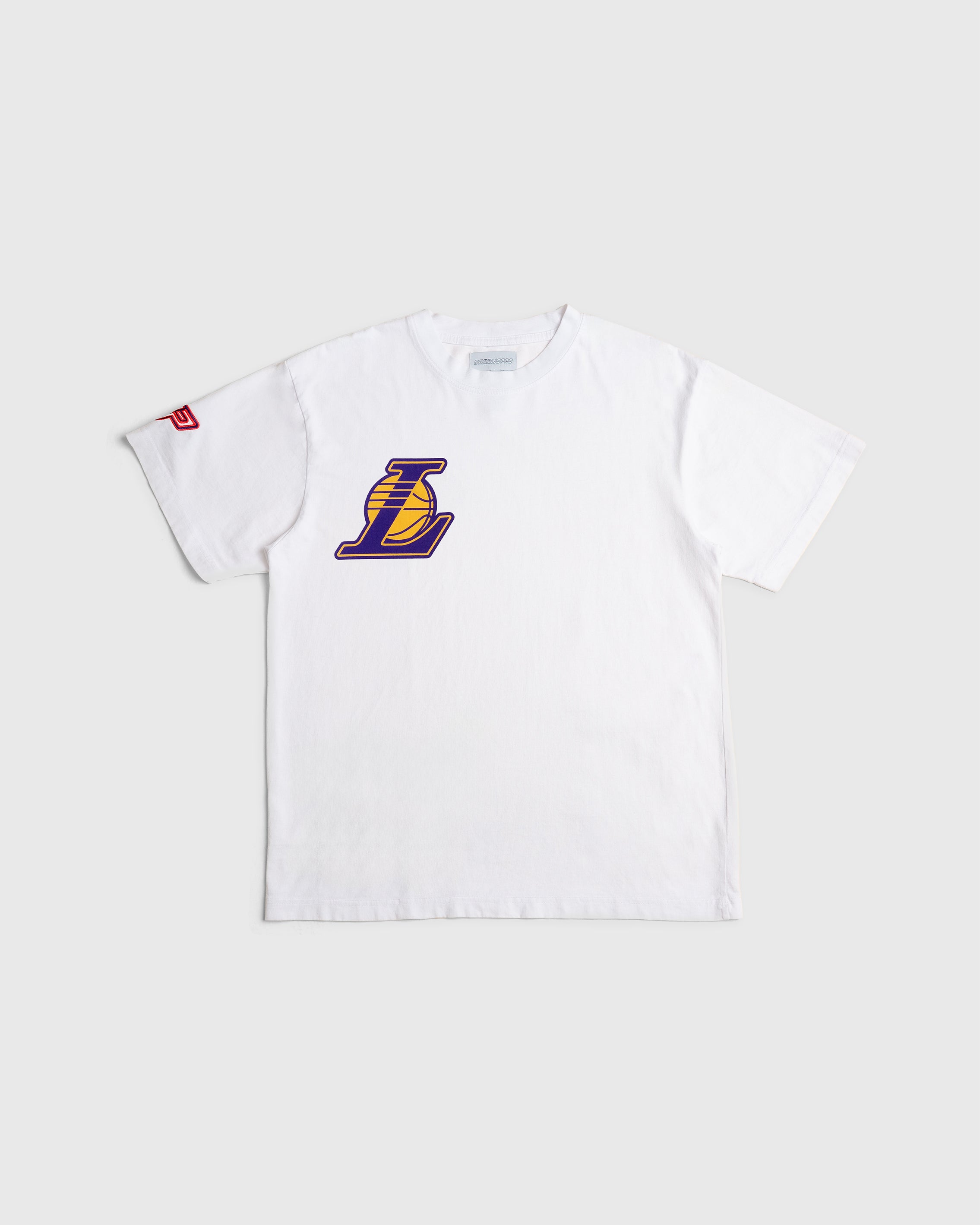 A white crew-neck t-shirt with the Los Angeles Lakers logo in purple on the front