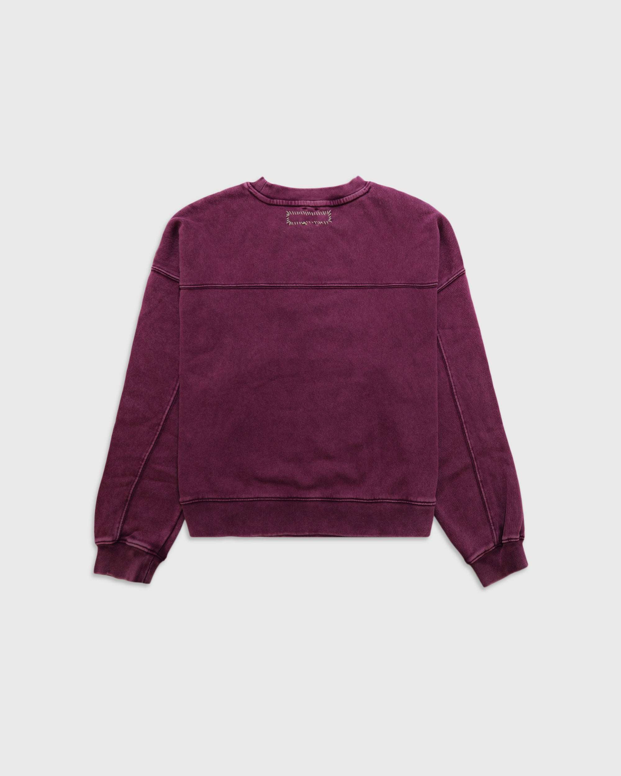 Back view of purple Whip Stitch Crewneck sweatshirt with dropped shoulders and ribbed cuffs