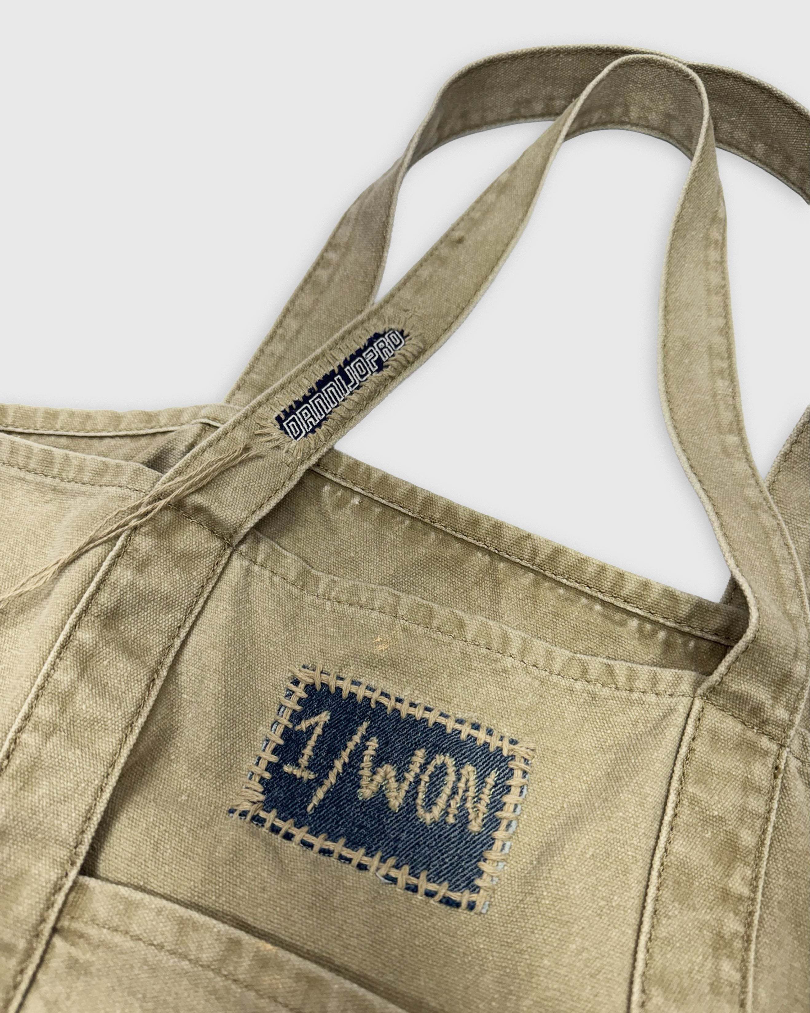 Hand-stitched and distressed Denim Initial Bag with custom patch and sturdy straps