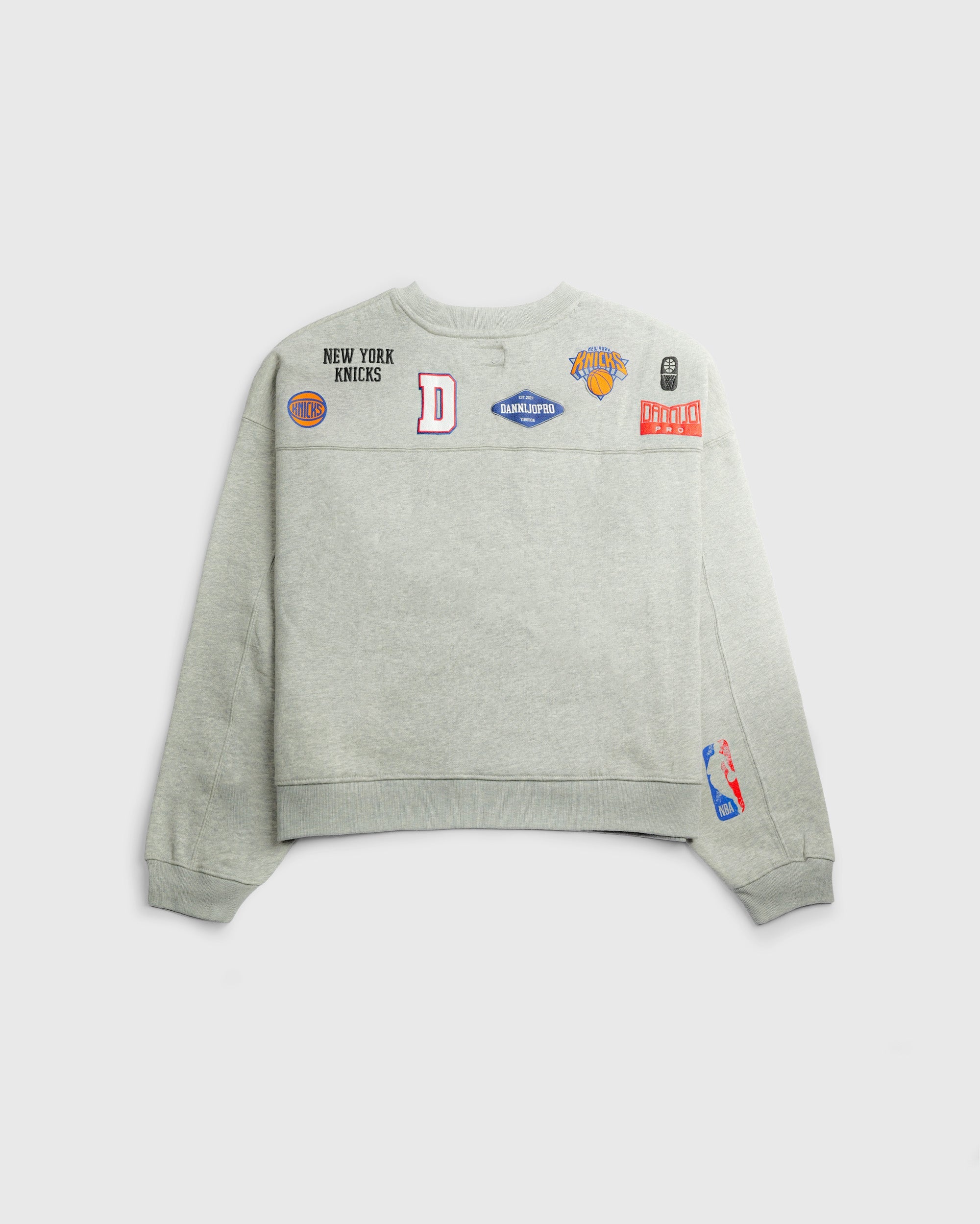 The Collegiate Crewneck Knicks gray sweatshirt with NBA team logos and patches