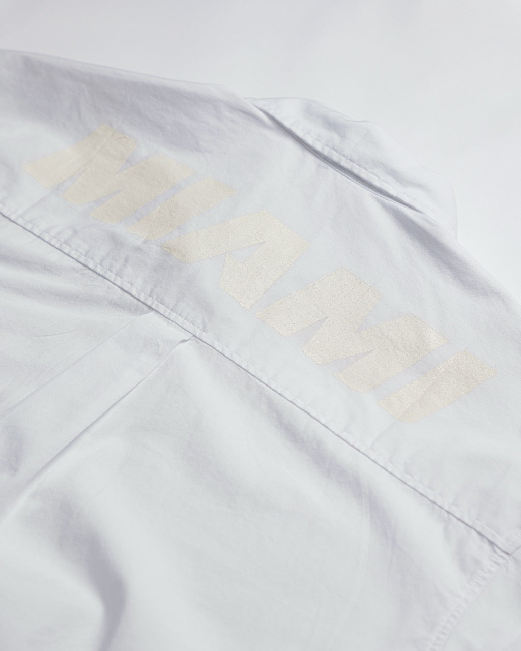 White Sports Oxford in Poplin shirt with subtle "DANNI" text on back, oversized relaxed fit, cotton fabric