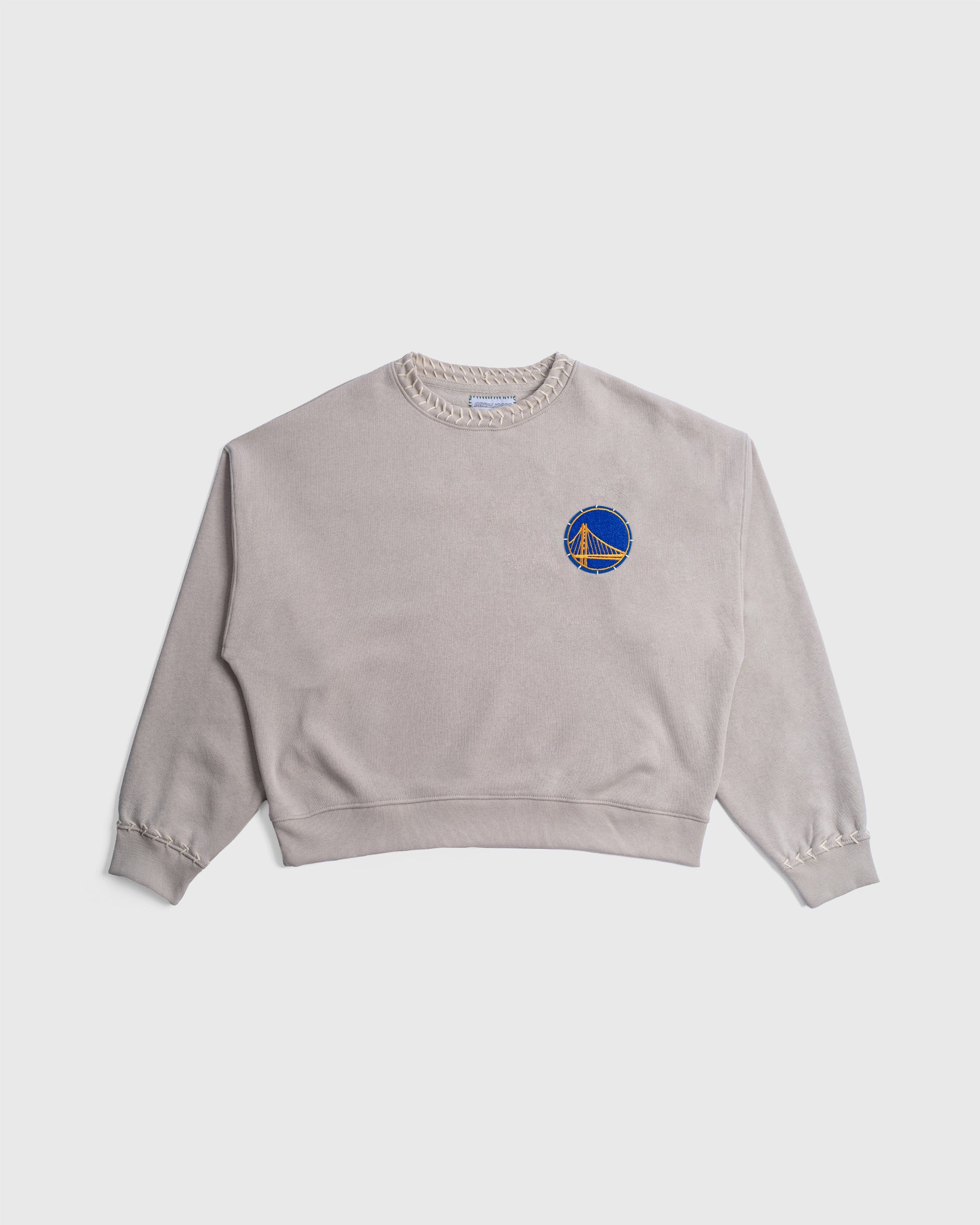 Hand-stitched Warriors Crew beige NBA crewneck with chenille Golden State Warriors logo.