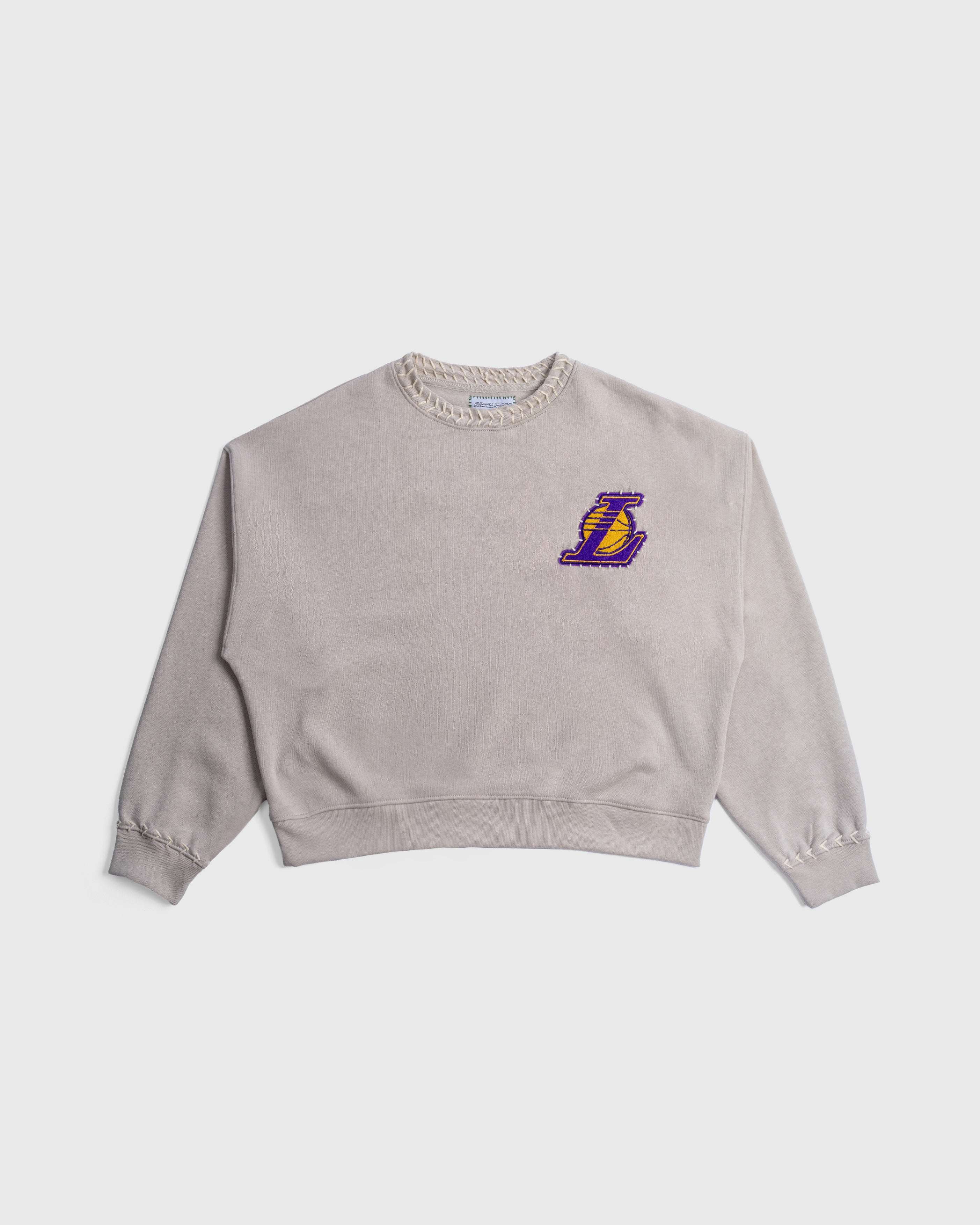 Hand-Stitched Lakers Crew sweatshirt with chenille Lakers logo on chest, soft beige fabric, ribbed cuffs and hem.